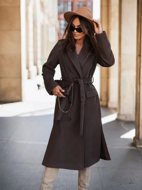 Timeless elegance for cold days. A sleek long-sleeve coat with a belted silhouette—where comfort meets modern sophistication.