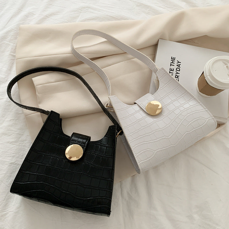 Bolsa de ombro com estampa de crocodilo de cor sólida