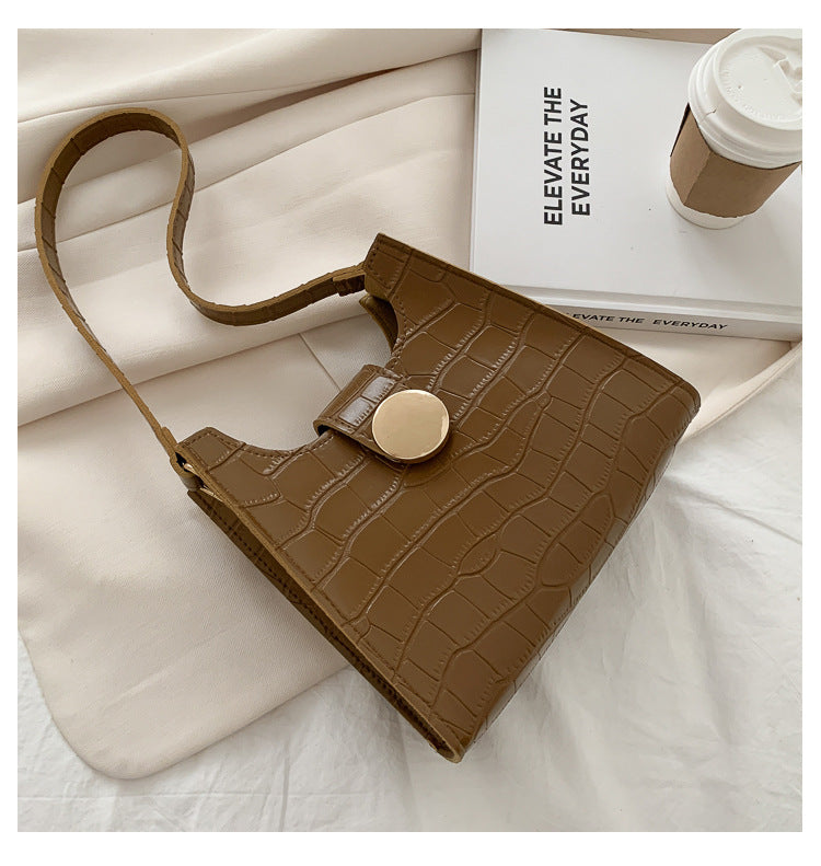 Bolsa de ombro com estampa de crocodilo de cor sólida