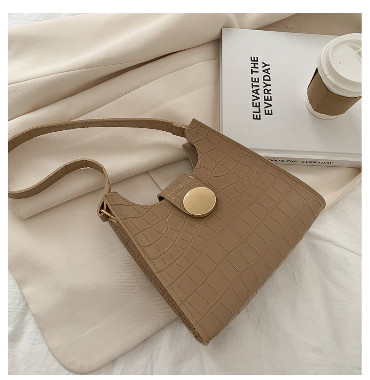 Bolsa de ombro com estampa de crocodilo de cor sólida