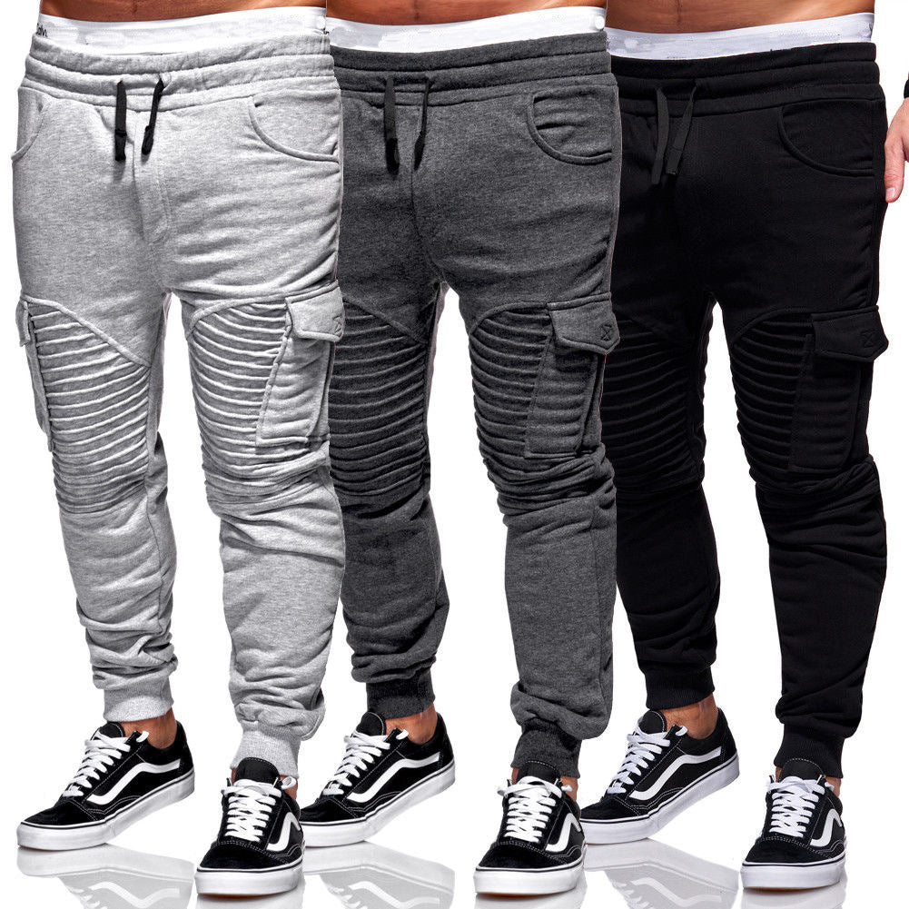Calças de fitness com costura plissada masculina e bolsos laterais grandes