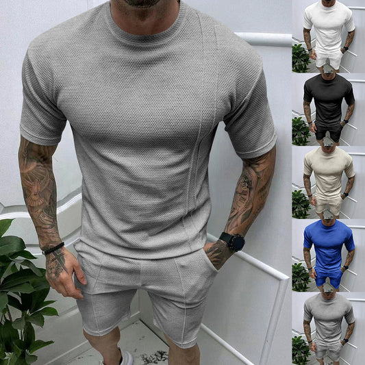 Traje deportivo y de ocio con pantalones cortos y cuello redondo y manga corta