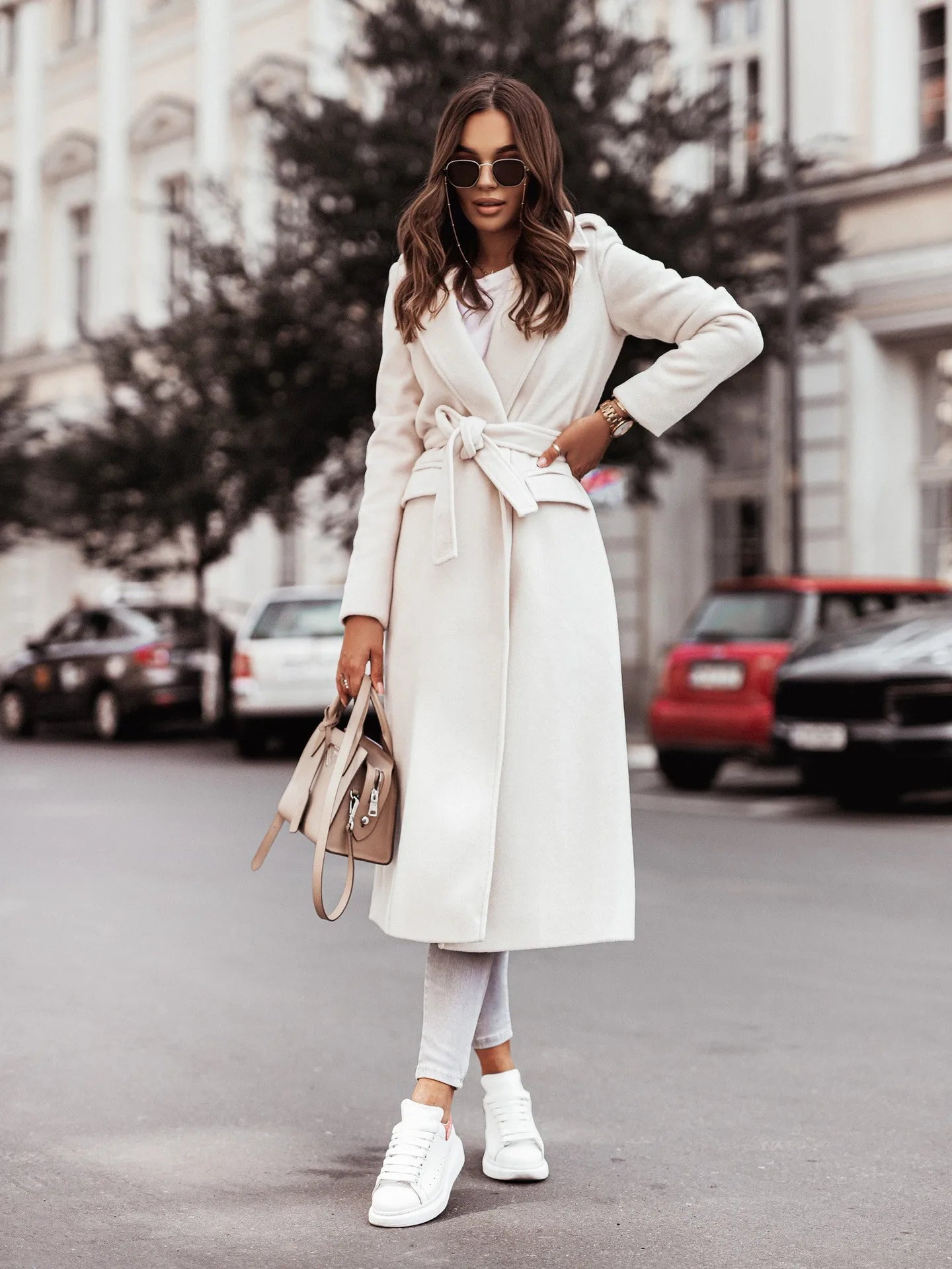 Fashionable women’s wool coat with long sleeves and a belted wrap design. Elegant and versatile — perfect for spring and autumn.