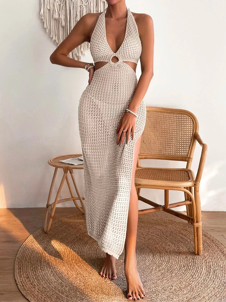 Elegant knit dress with round neck and cut-out details. Modern, stylish, and perfect for any occasion.