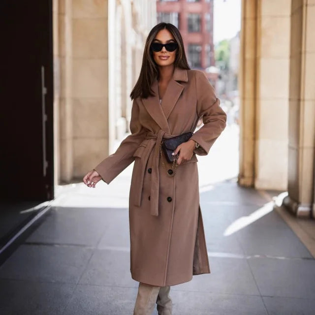 Timeless elegance for cold days. A sleek long-sleeve coat with a belted silhouette—where comfort meets modern sophistication.