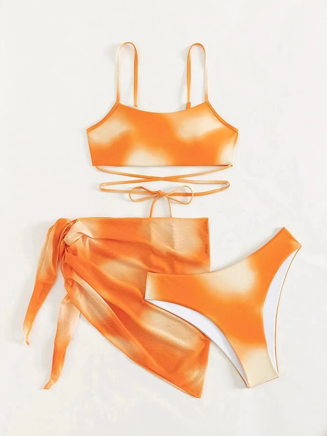 Stylish Tie-Dye 3-Piece Bikini Set with Mesh Skirt. Perfect for summer!