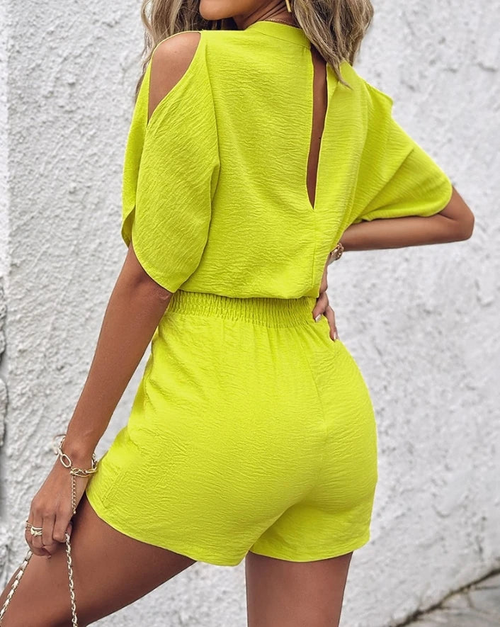 Summer 2026 elegance: cold-shoulder jumpsuit with a high waist.