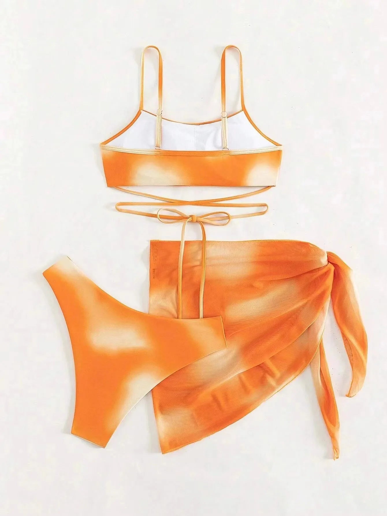 Stylish Tie-Dye 3-Piece Bikini Set with Mesh Skirt. Perfect for summer!