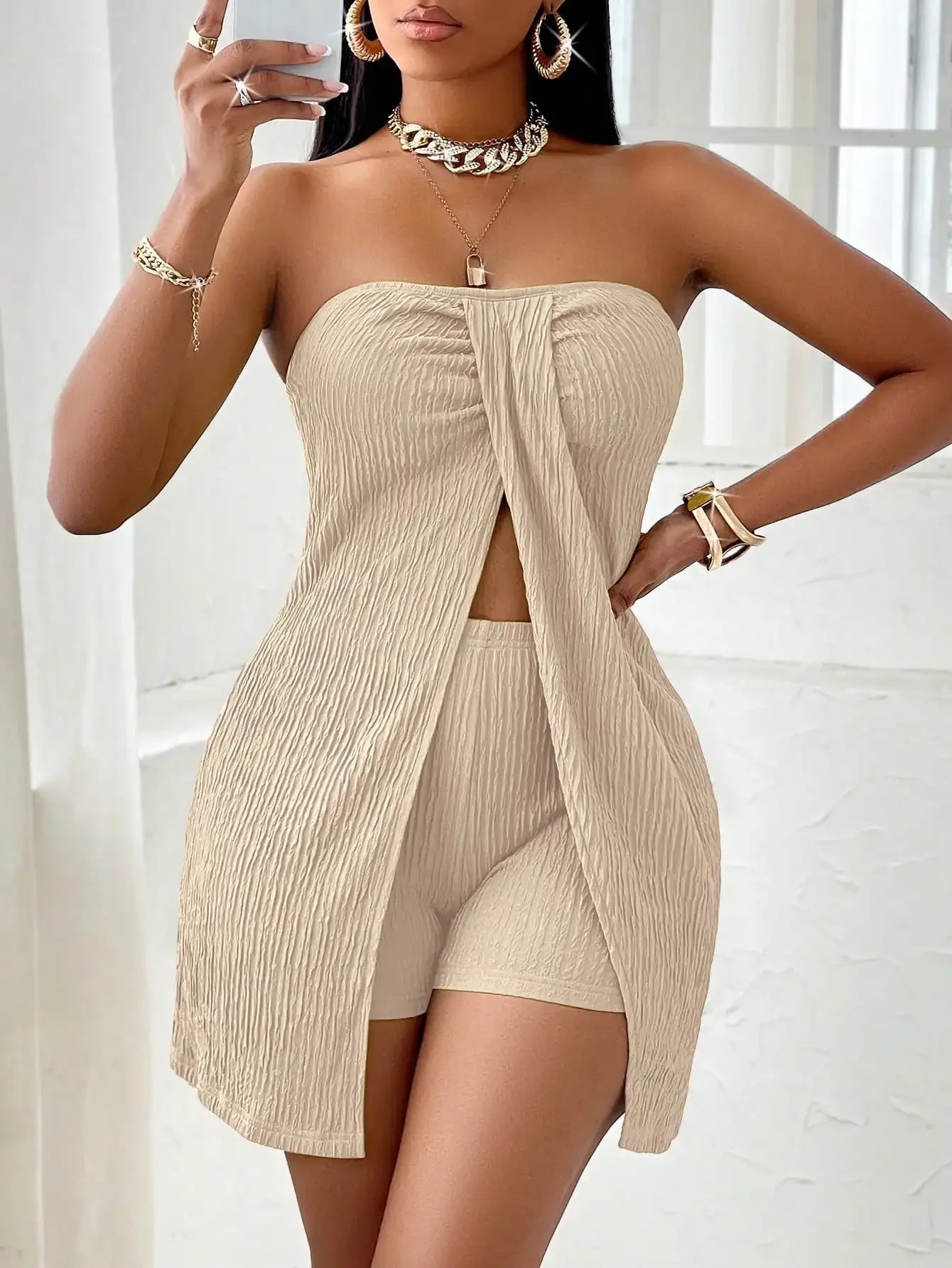 Asymmetrical shoulder top and shorts set in solid color. Stylish open-front design, perfect for a modern summer look.