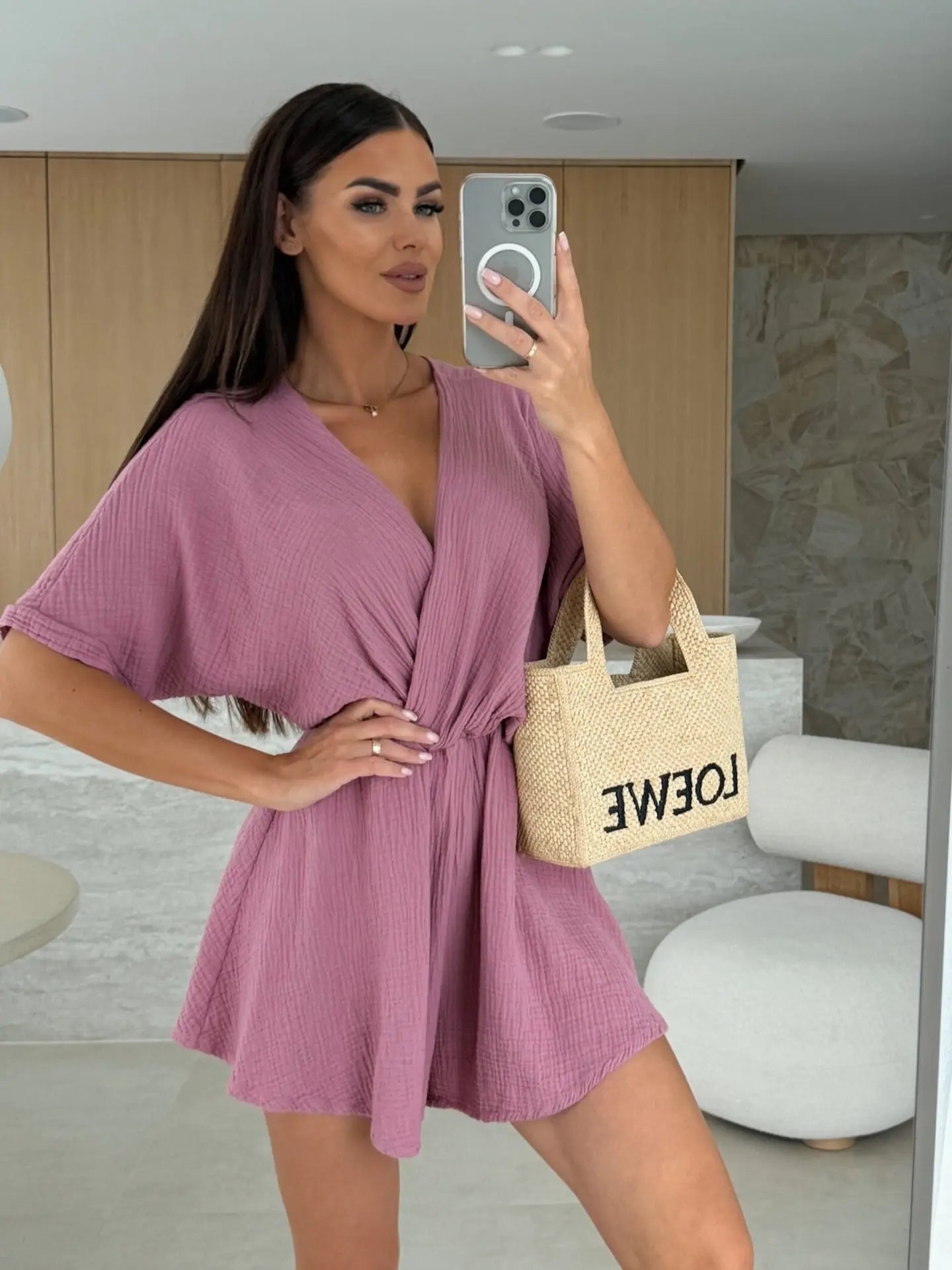 Elegant white romper with a deep V-neck and short sleeves — light, effortless, and perfect for summer days.
