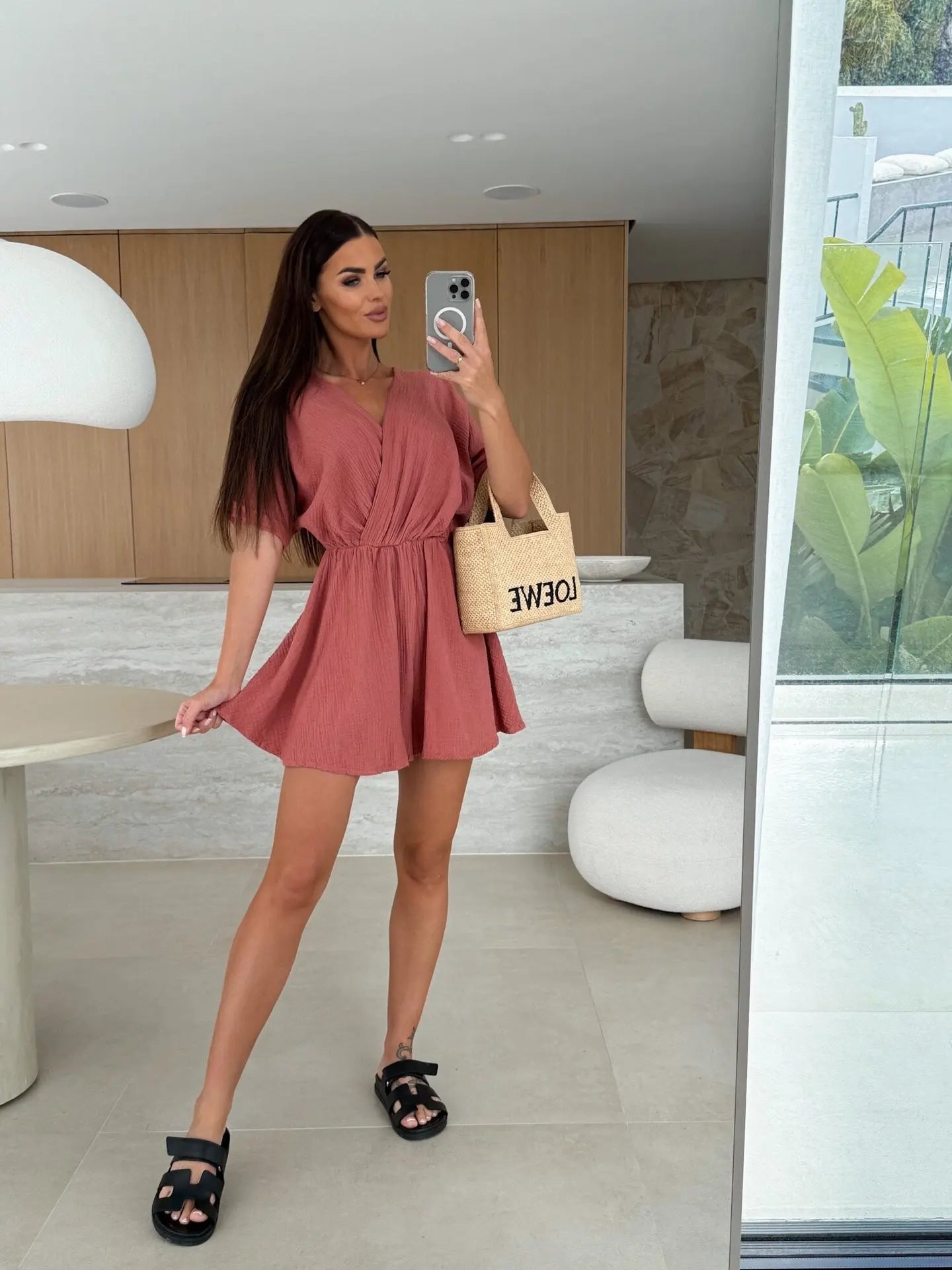 Elegant white romper with a deep V-neck and short sleeves — light, effortless, and perfect for summer days.