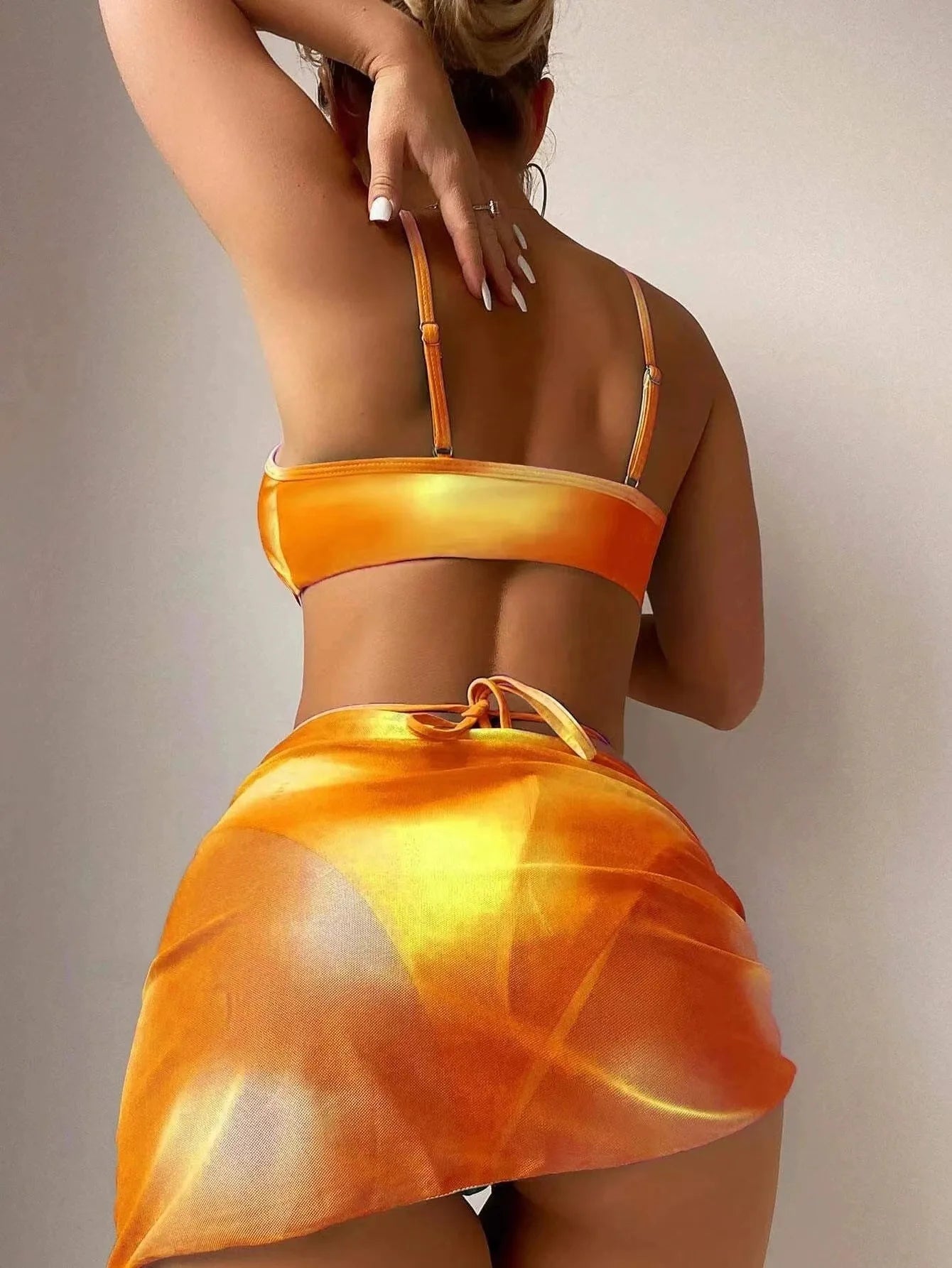 Stylish Tie-Dye 3-Piece Bikini Set with Mesh Skirt. Perfect for summer!