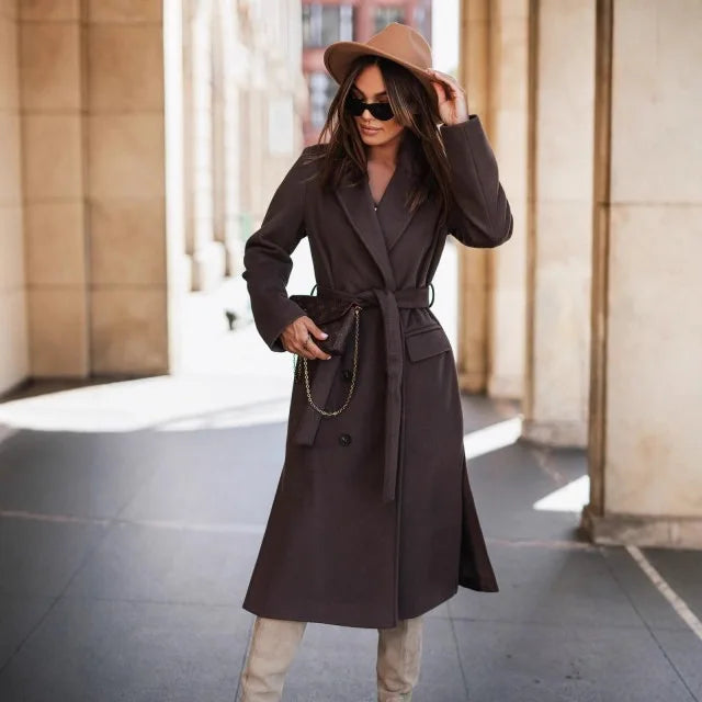 Timeless elegance for cold days. A sleek long-sleeve coat with a belted silhouette—where comfort meets modern sophistication.