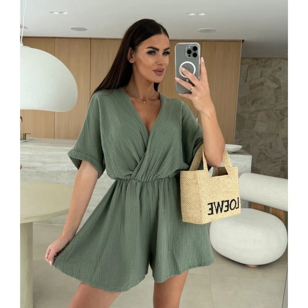 Elegant white romper with a deep V-neck and short sleeves — light, effortless, and perfect for summer days.
