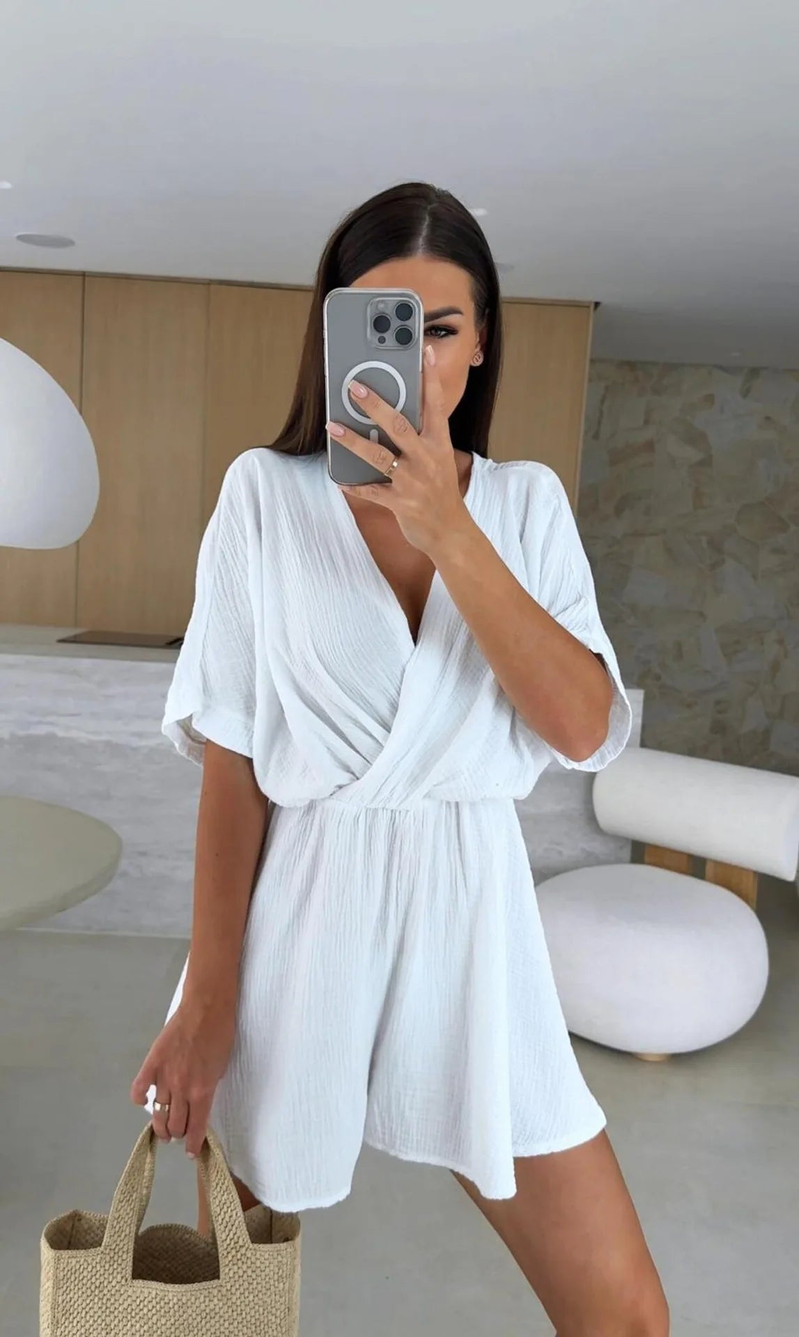 Elegant white romper with a deep V-neck and short sleeves — light, effortless, and perfect for summer days.