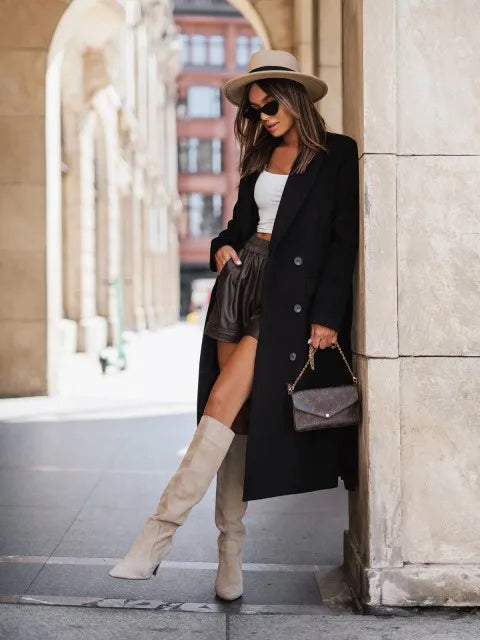 Timeless elegance for cold days. A sleek long-sleeve coat with a belted silhouette—where comfort meets modern sophistication.