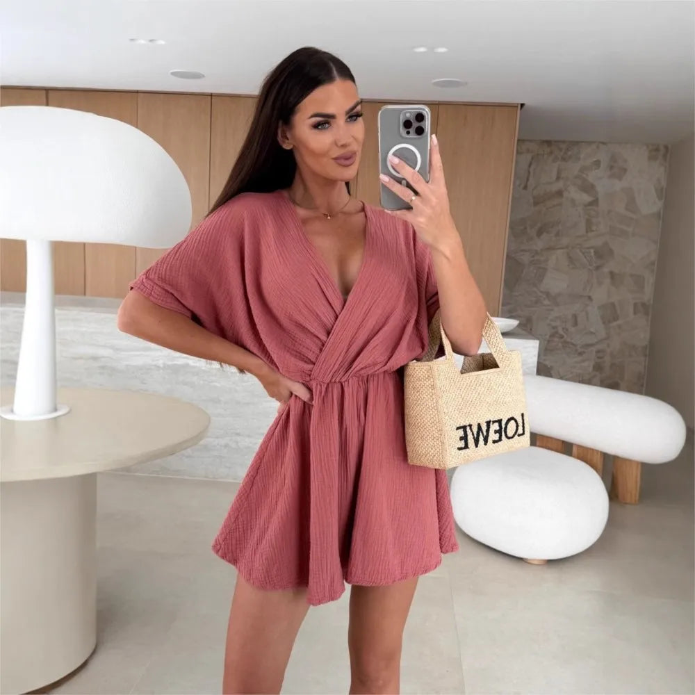 Elegant white romper with a deep V-neck and short sleeves — light, effortless, and perfect for summer days.