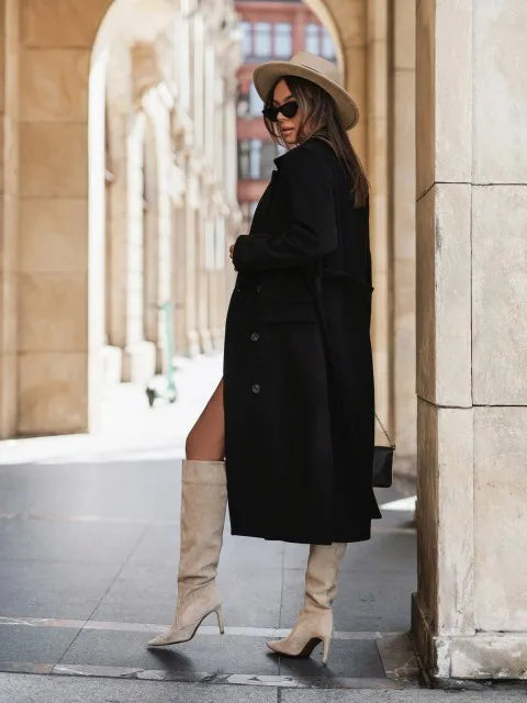 Timeless elegance for cold days. A sleek long-sleeve coat with a belted silhouette—where comfort meets modern sophistication.