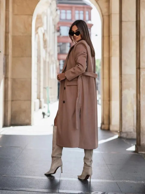Timeless elegance for cold days. A sleek long-sleeve coat with a belted silhouette—where comfort meets modern sophistication.