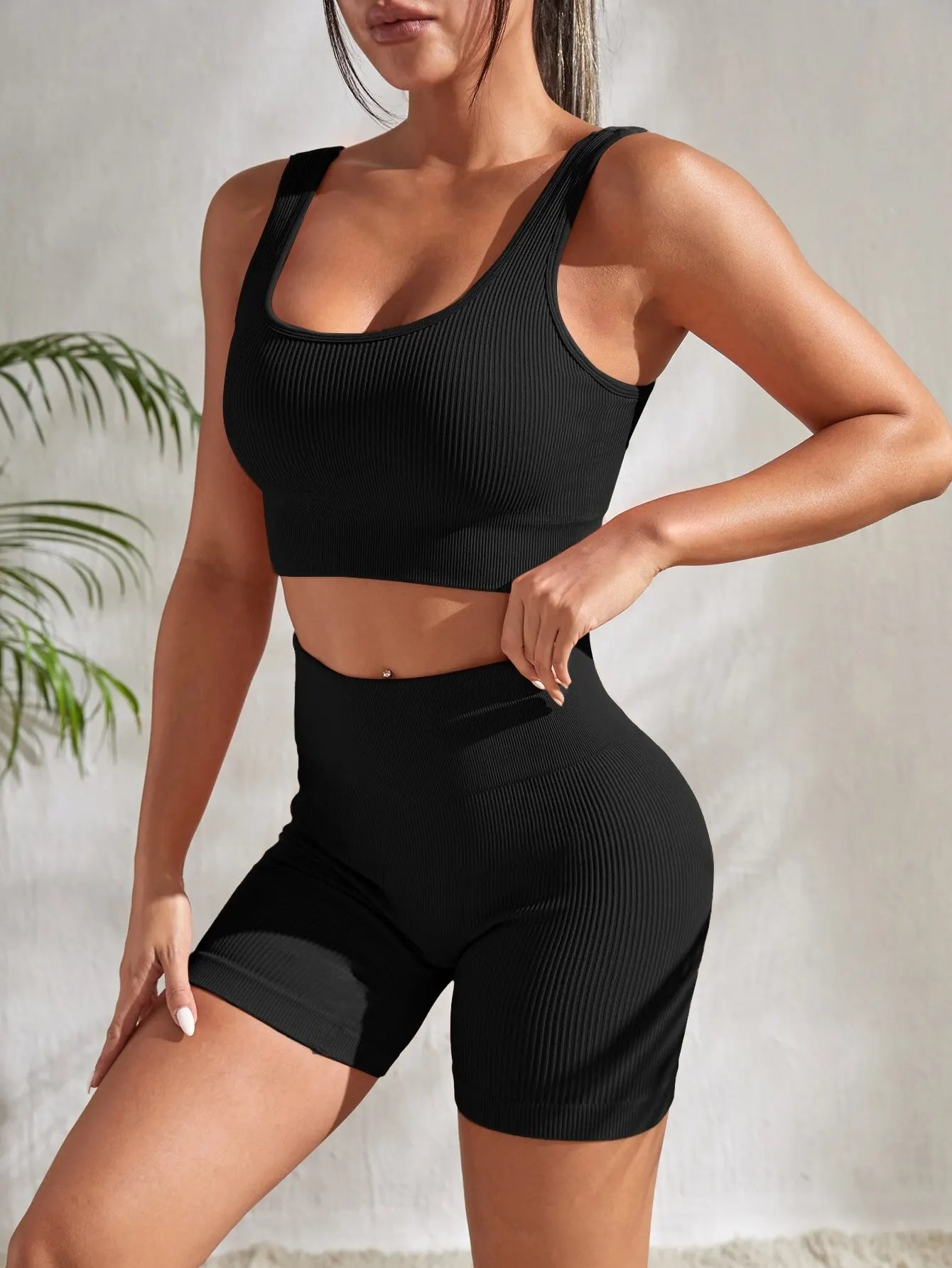 2-piece women's workout set – ribbed crop top and high-waist shorts.
