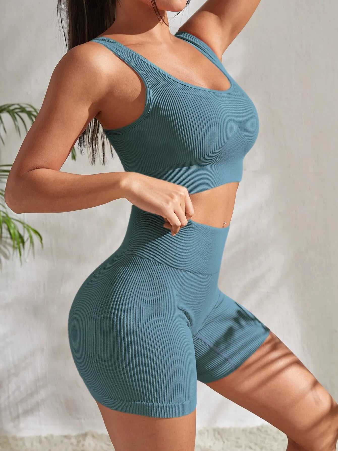 2-piece women's workout set – ribbed crop top and high-waist shorts.