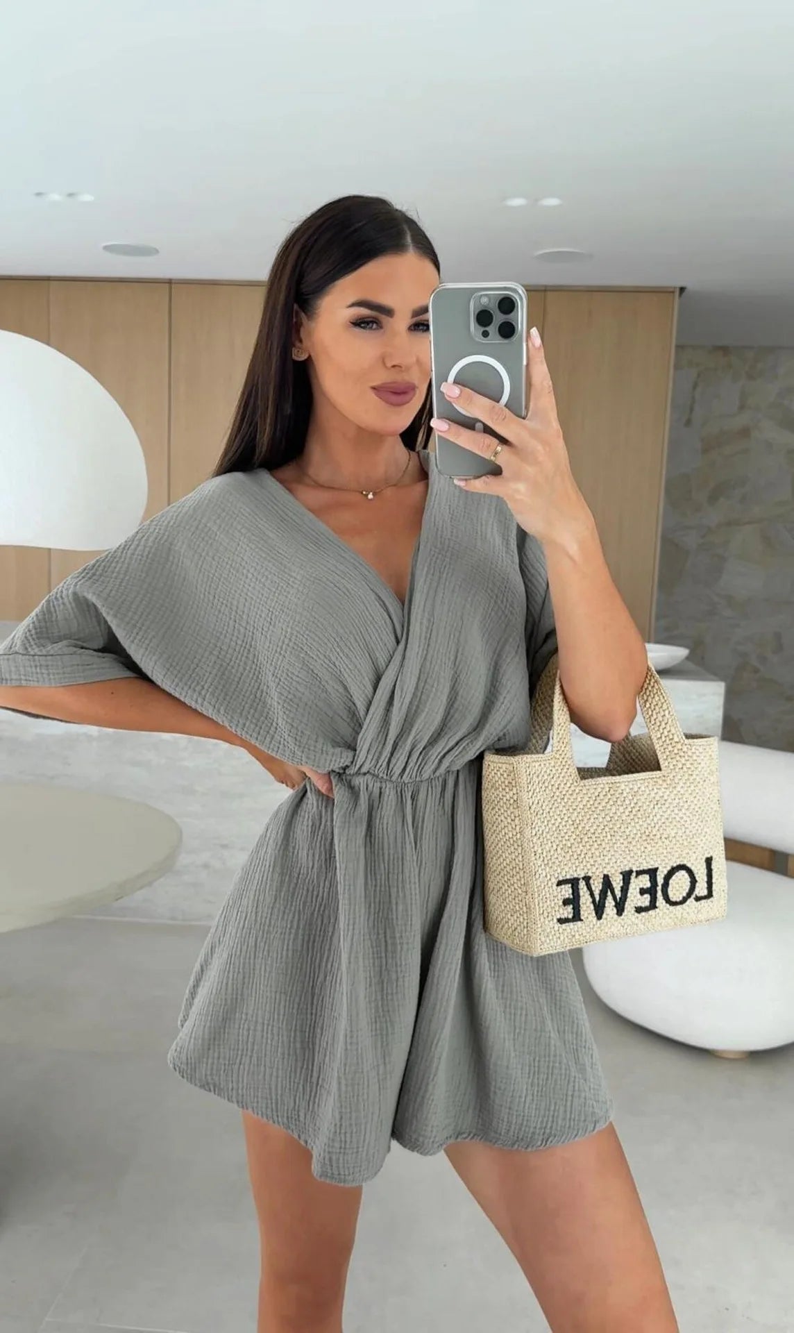 Elegant white romper with a deep V-neck and short sleeves — light, effortless, and perfect for summer days.