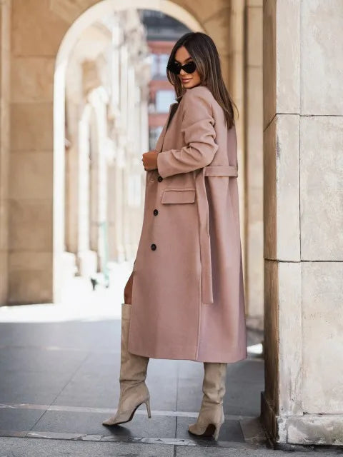 Timeless elegance for cold days. A sleek long-sleeve coat with a belted silhouette—where comfort meets modern sophistication.