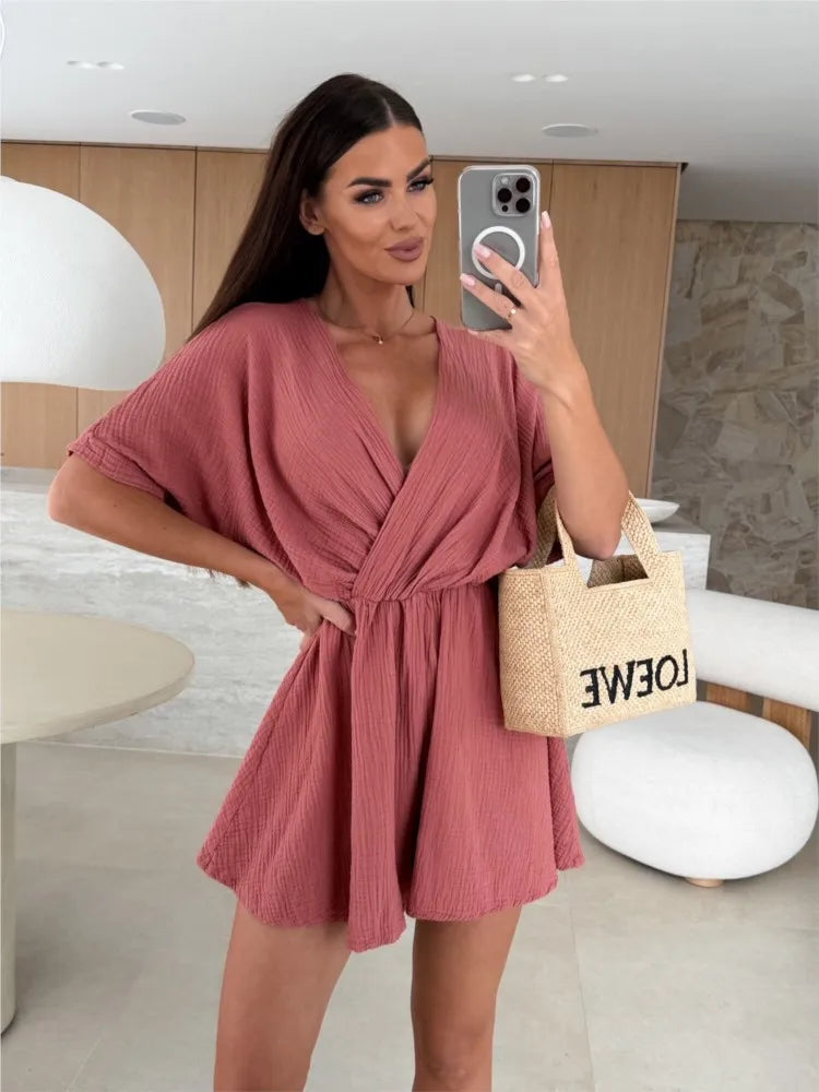 Elegant white romper with a deep V-neck and short sleeves — light, effortless, and perfect for summer days.