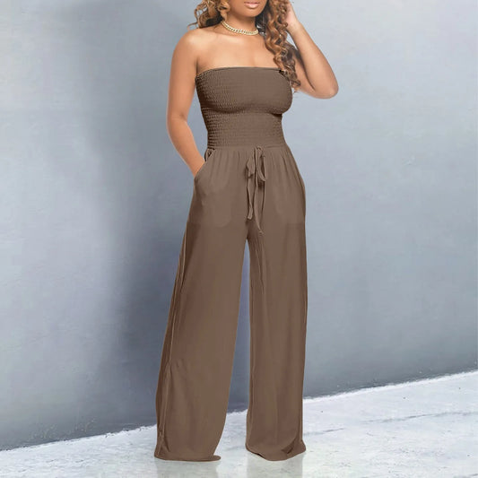 Strapless jumpsuit with ruched detail and lace-up design. Wide-leg, stylish, and perfect for a bold look.