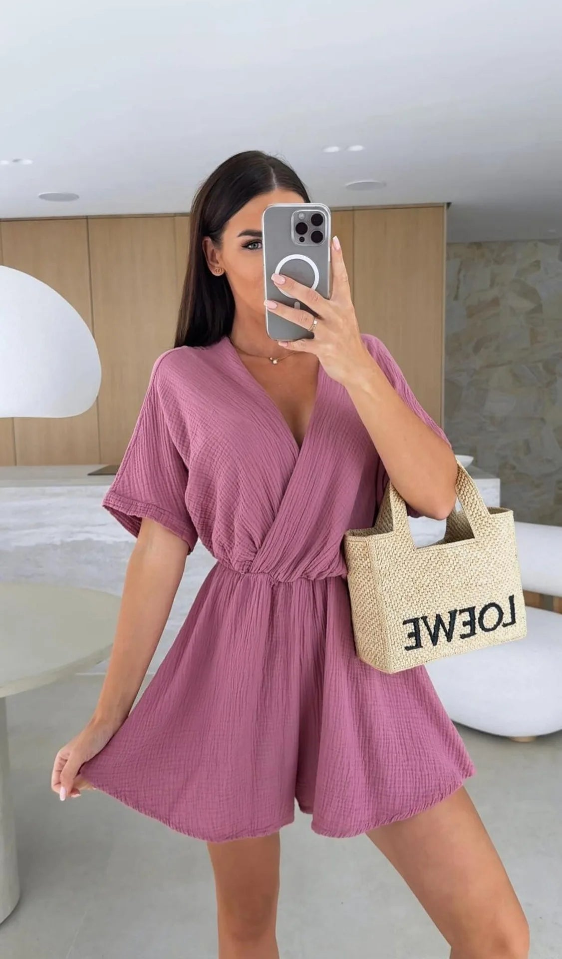 Elegant white romper with a deep V-neck and short sleeves — light, effortless, and perfect for summer days.