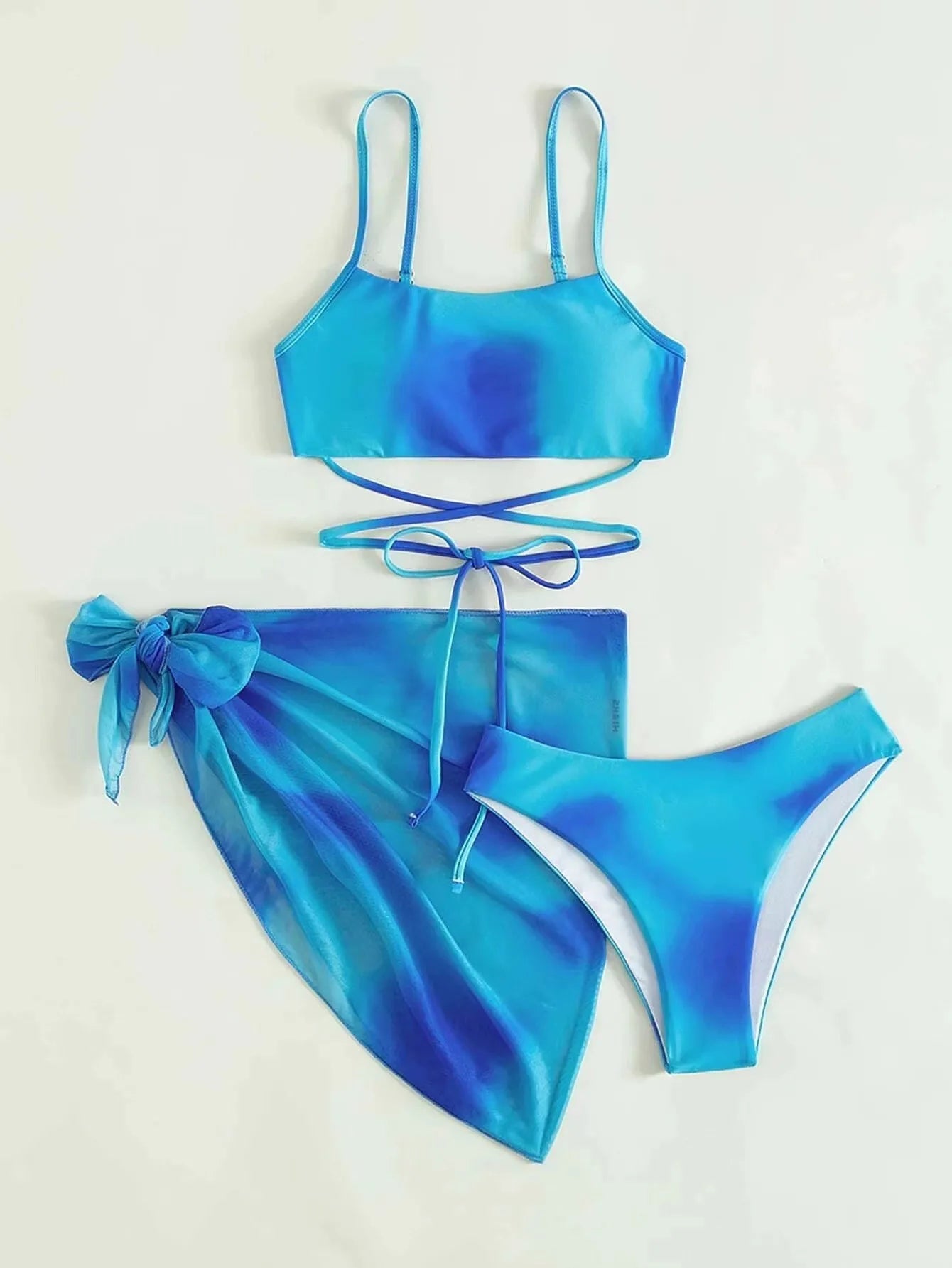Stylish Tie-Dye 3-Piece Bikini Set with Mesh Skirt. Perfect for summer!