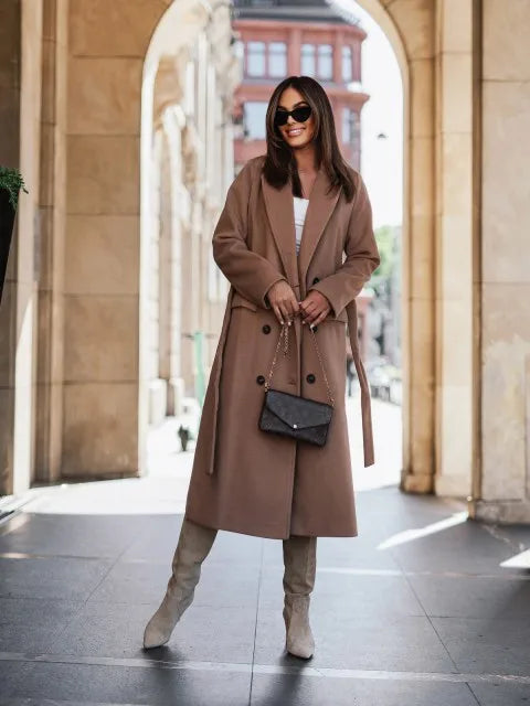 Timeless elegance for cold days. A sleek long-sleeve coat with a belted silhouette—where comfort meets modern sophistication.