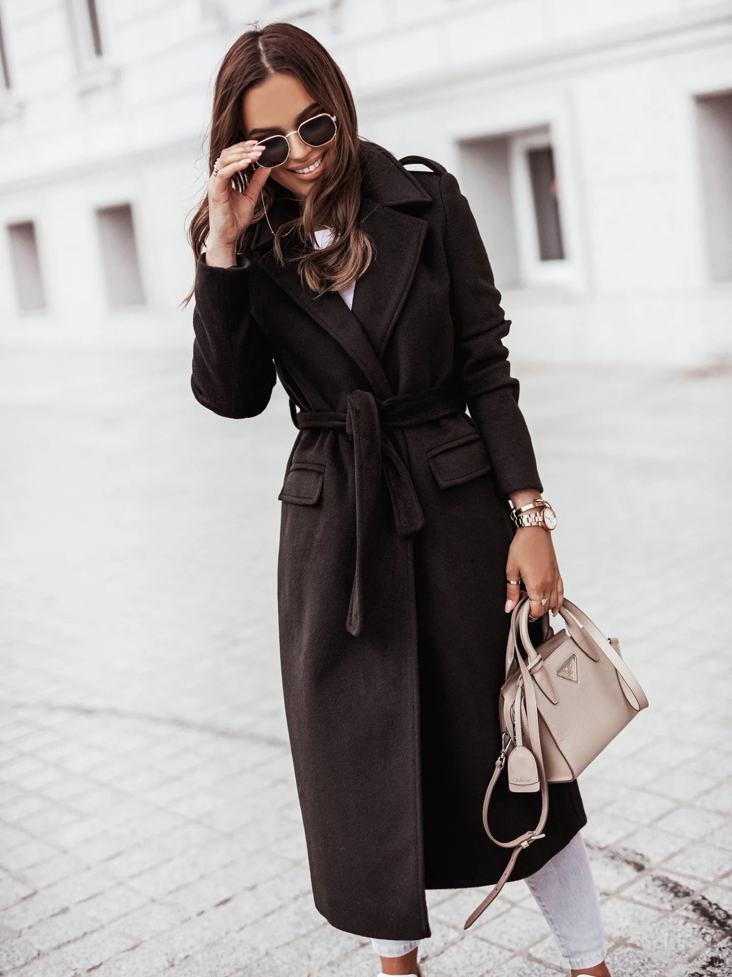 Fashionable women’s wool coat with long sleeves and a belted wrap design. Elegant and versatile — perfect for spring and autumn.