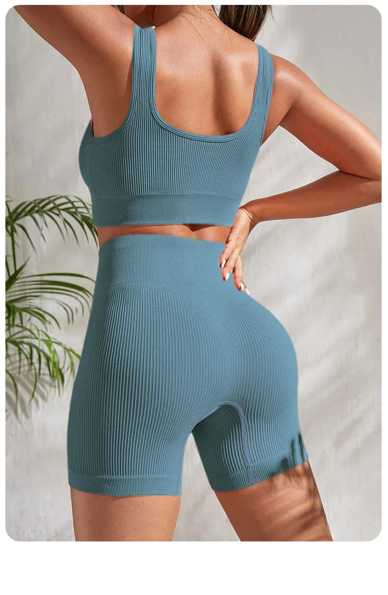 2-piece women's workout set – ribbed crop top and high-waist shorts.
