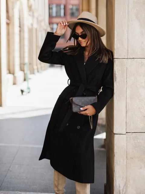 Timeless elegance for cold days. A sleek long-sleeve coat with a belted silhouette—where comfort meets modern sophistication.