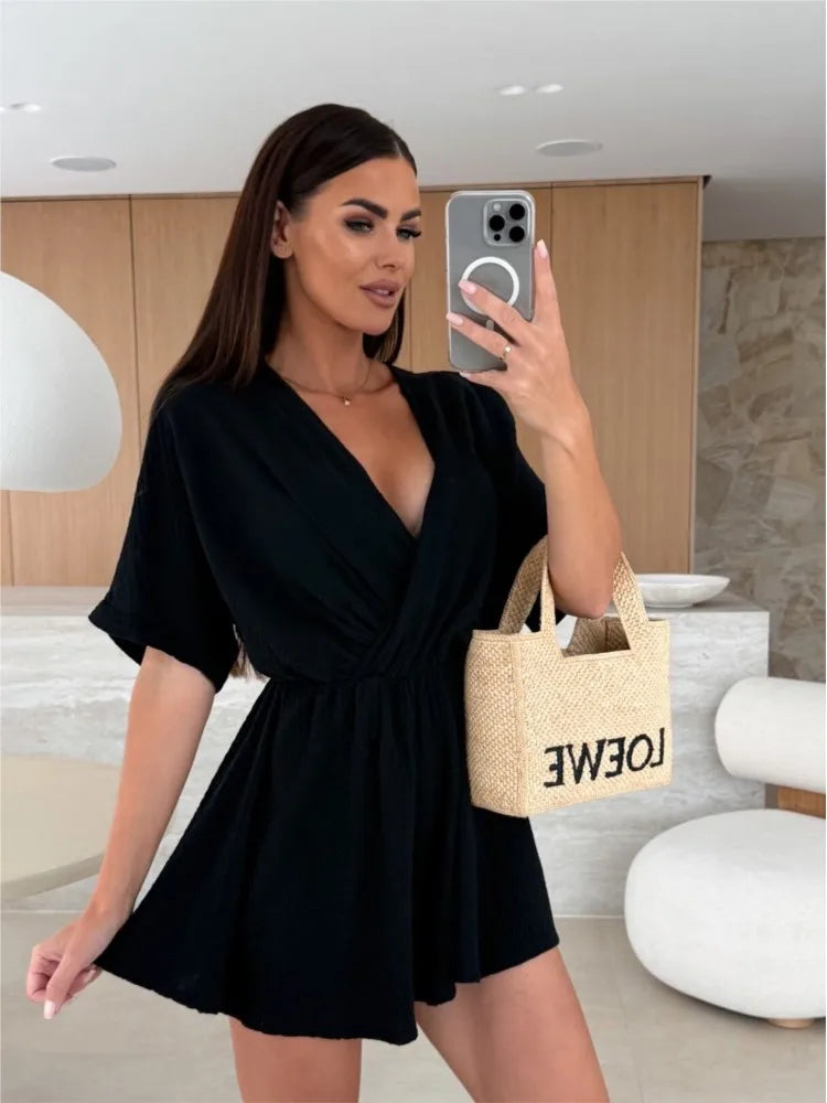 Elegant white romper with a deep V-neck and short sleeves — light, effortless, and perfect for summer days.