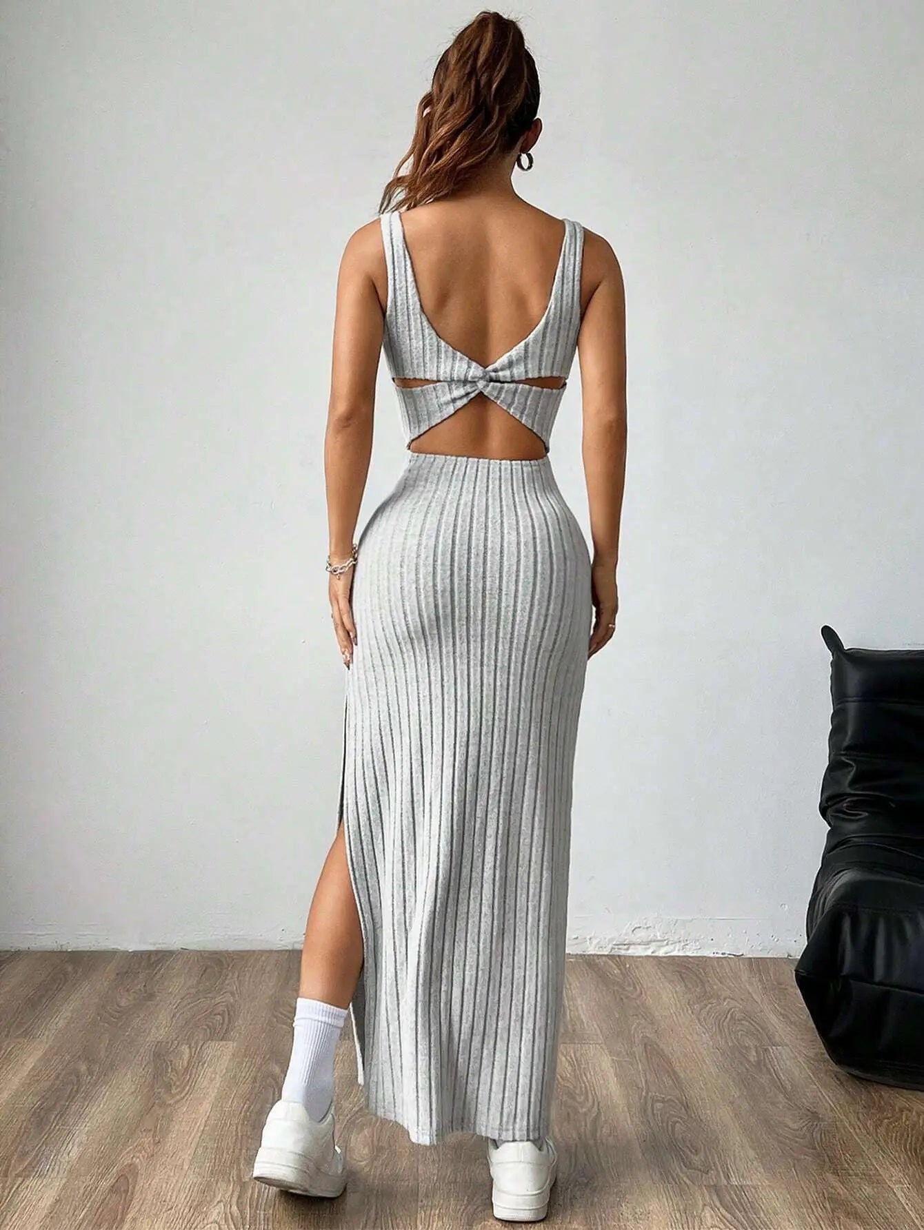 Elegant slim knitted dress with a backless design — sleek, modern, and effortlessly stylish.