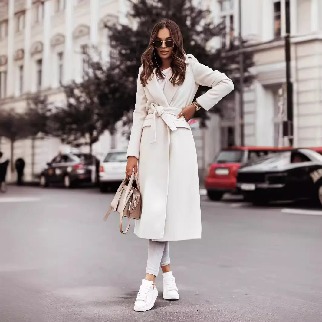 Fashionable women’s wool coat with long sleeves and a belted wrap design. Elegant and versatile — perfect for spring and autumn.