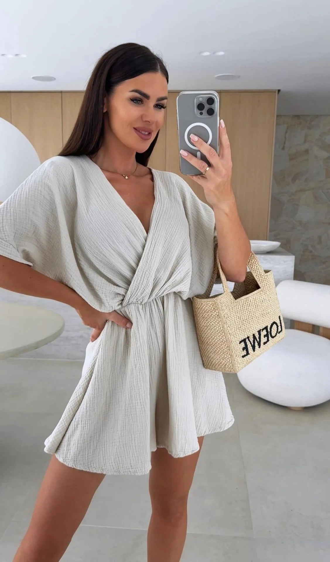 Elegant white romper with a deep V-neck and short sleeves — light, effortless, and perfect for summer days.