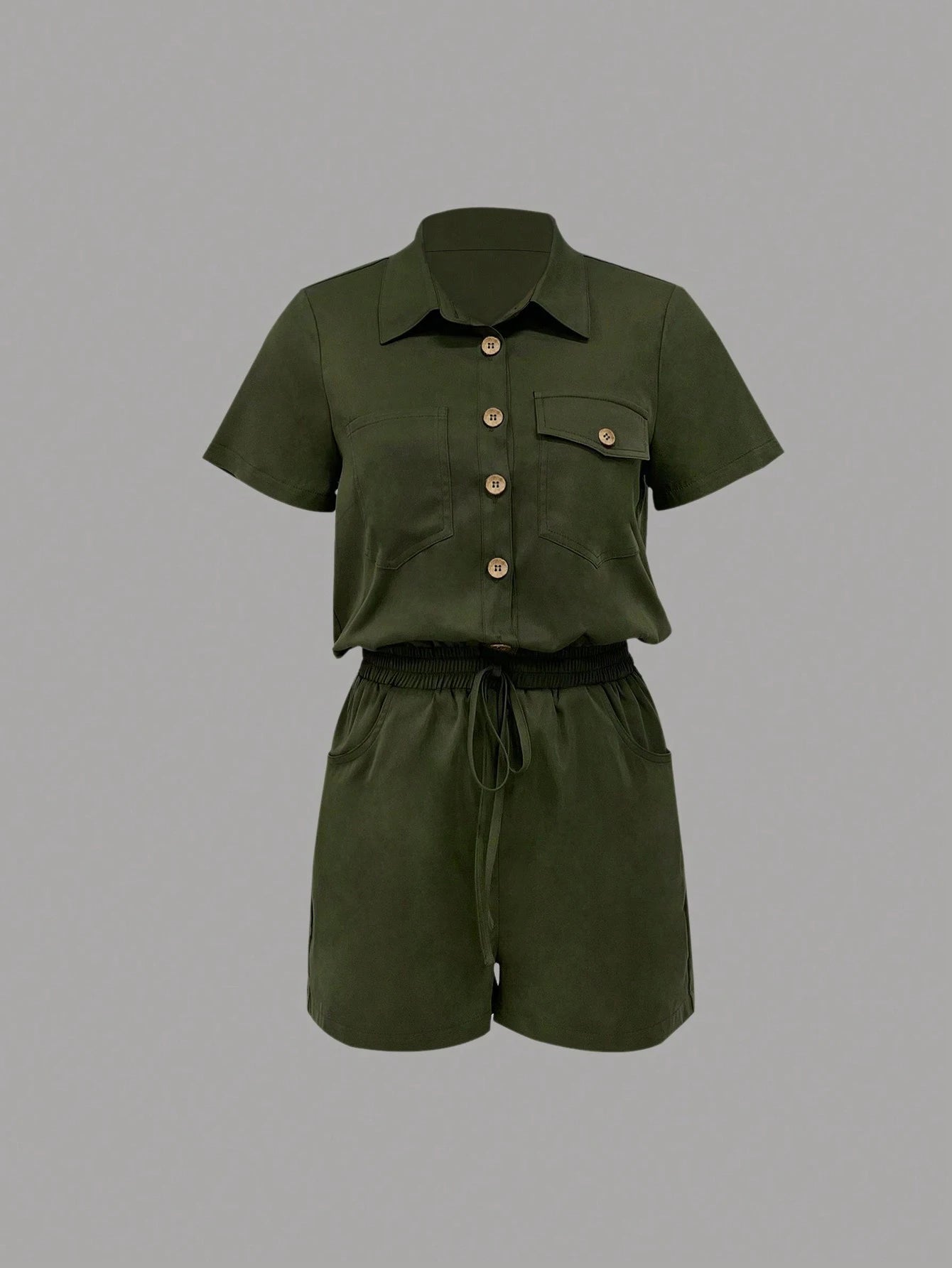 Summer jumpsuit with cinched waist and short sleeves. Elegant, loose fit, and perfect for everyday style.