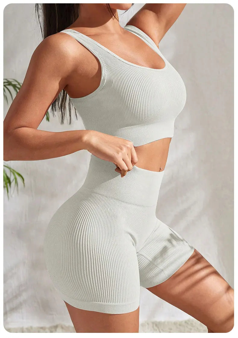 2-piece women's workout set – ribbed crop top and high-waist shorts.