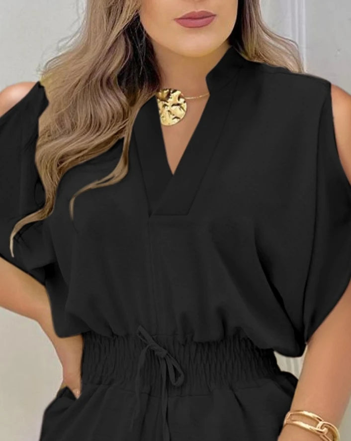 Summer 2026 elegance: cold-shoulder jumpsuit with a high waist.