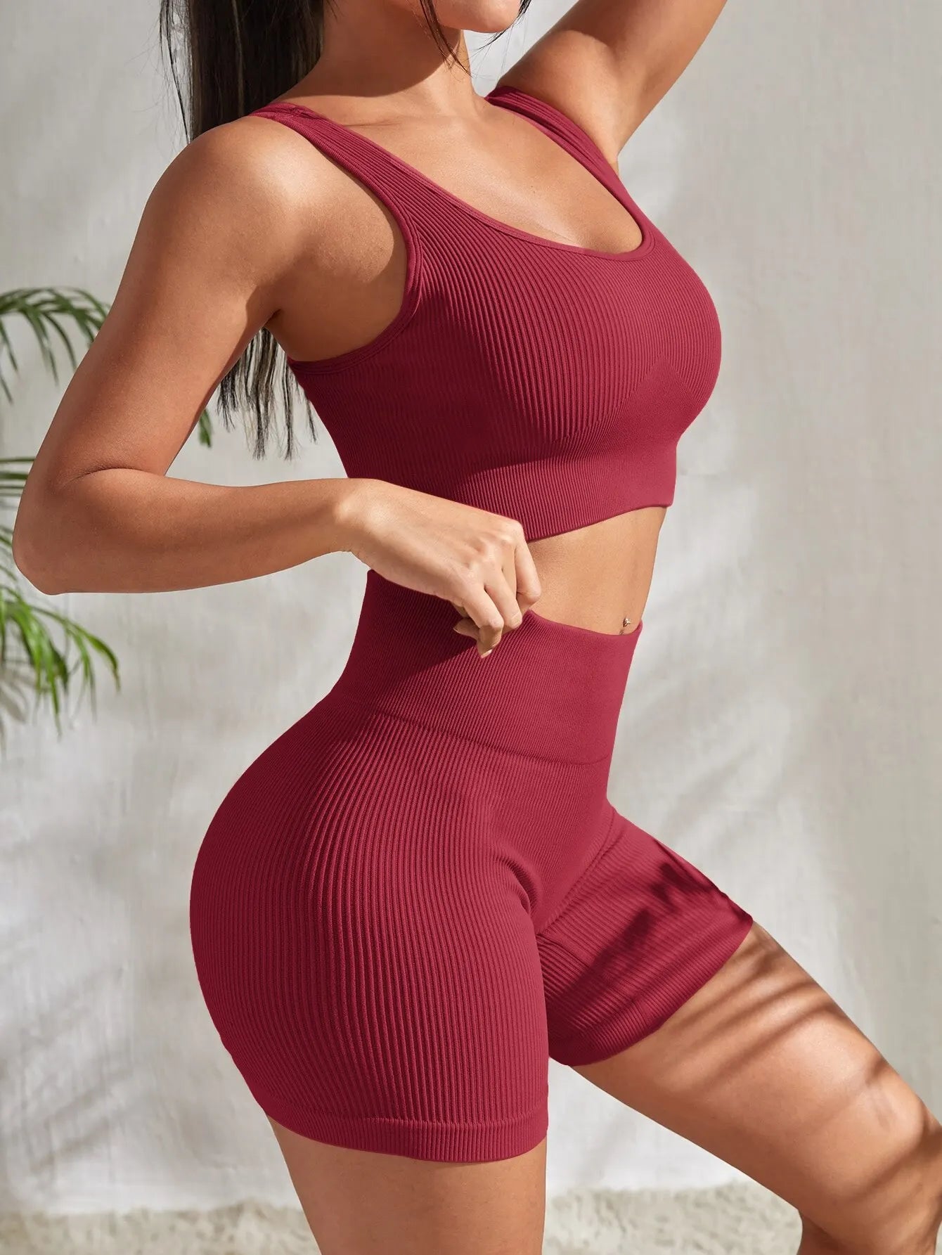 2-piece women's workout set – ribbed crop top and high-waist shorts.