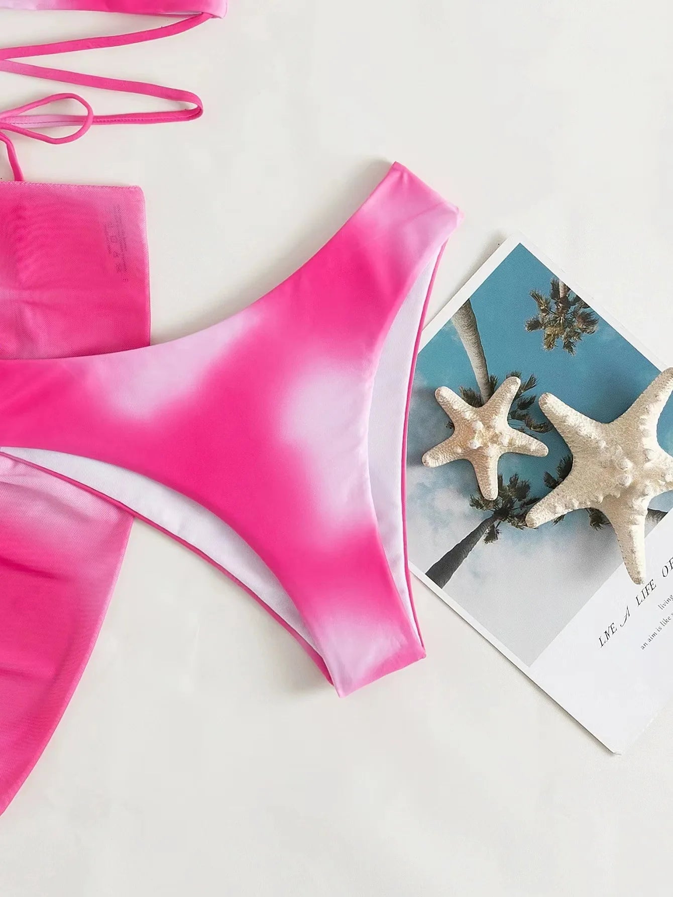 Stylish Tie-Dye 3-Piece Bikini Set with Mesh Skirt. Perfect for summer!
