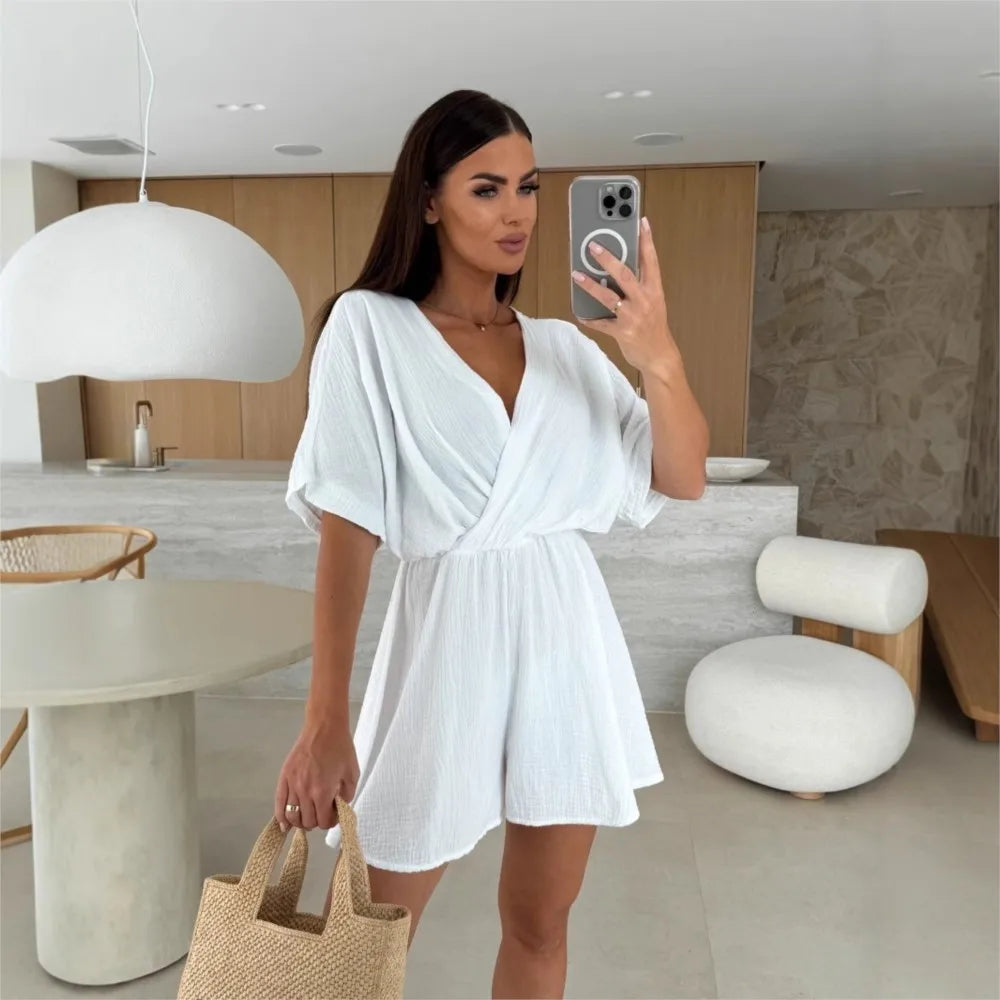 Elegant white romper with a deep V-neck and short sleeves — light, effortless, and perfect for summer days.