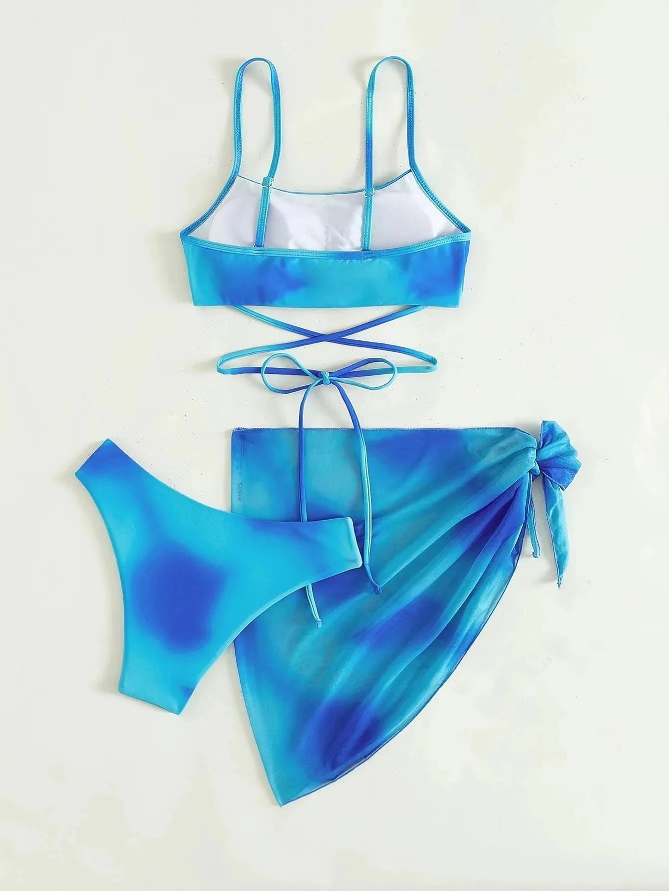 Stylish Tie-Dye 3-Piece Bikini Set with Mesh Skirt. Perfect for summer!
