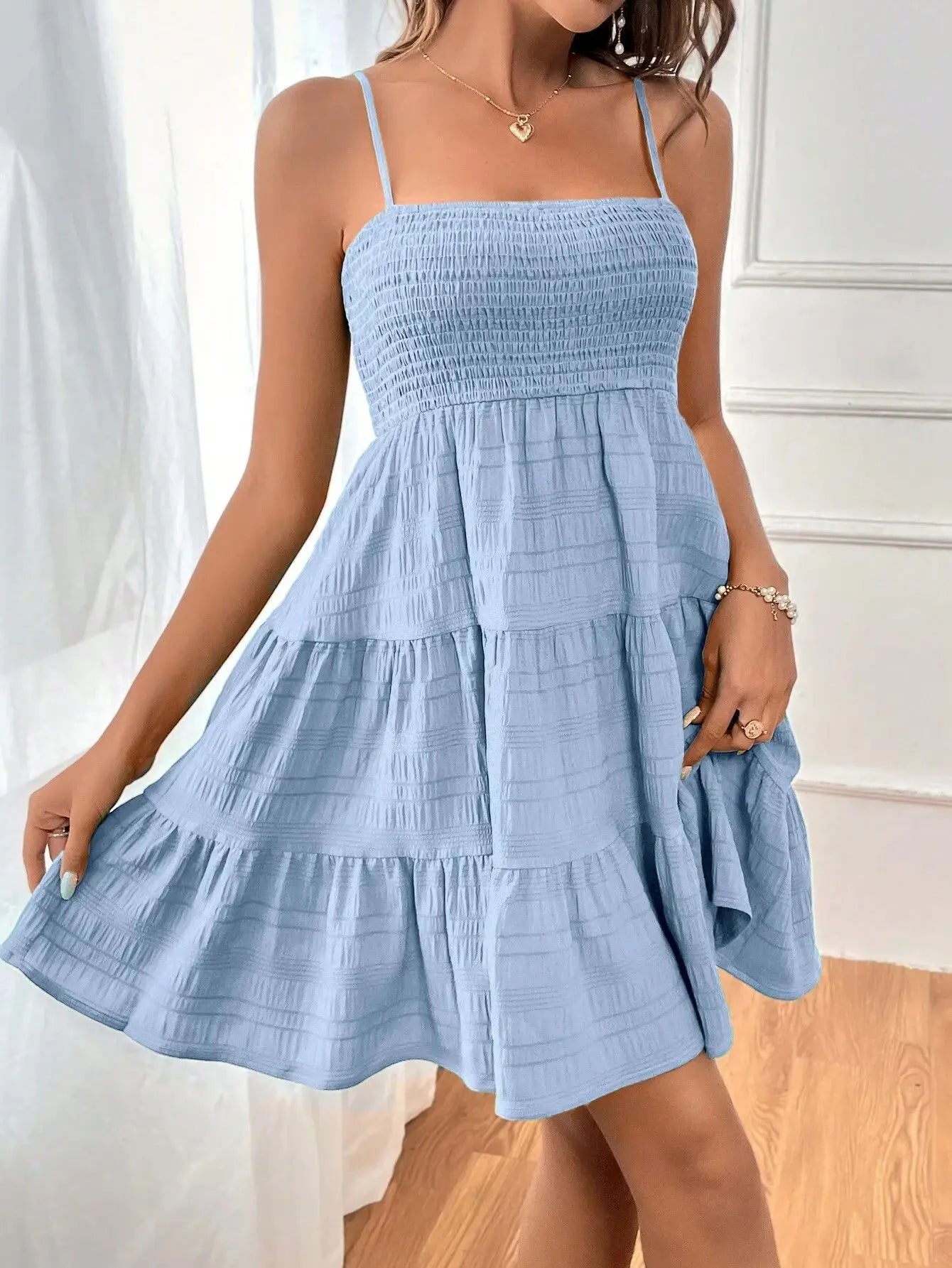Light, feminine, and effortlessly chic — the perfect mini dress for sunny escapes.