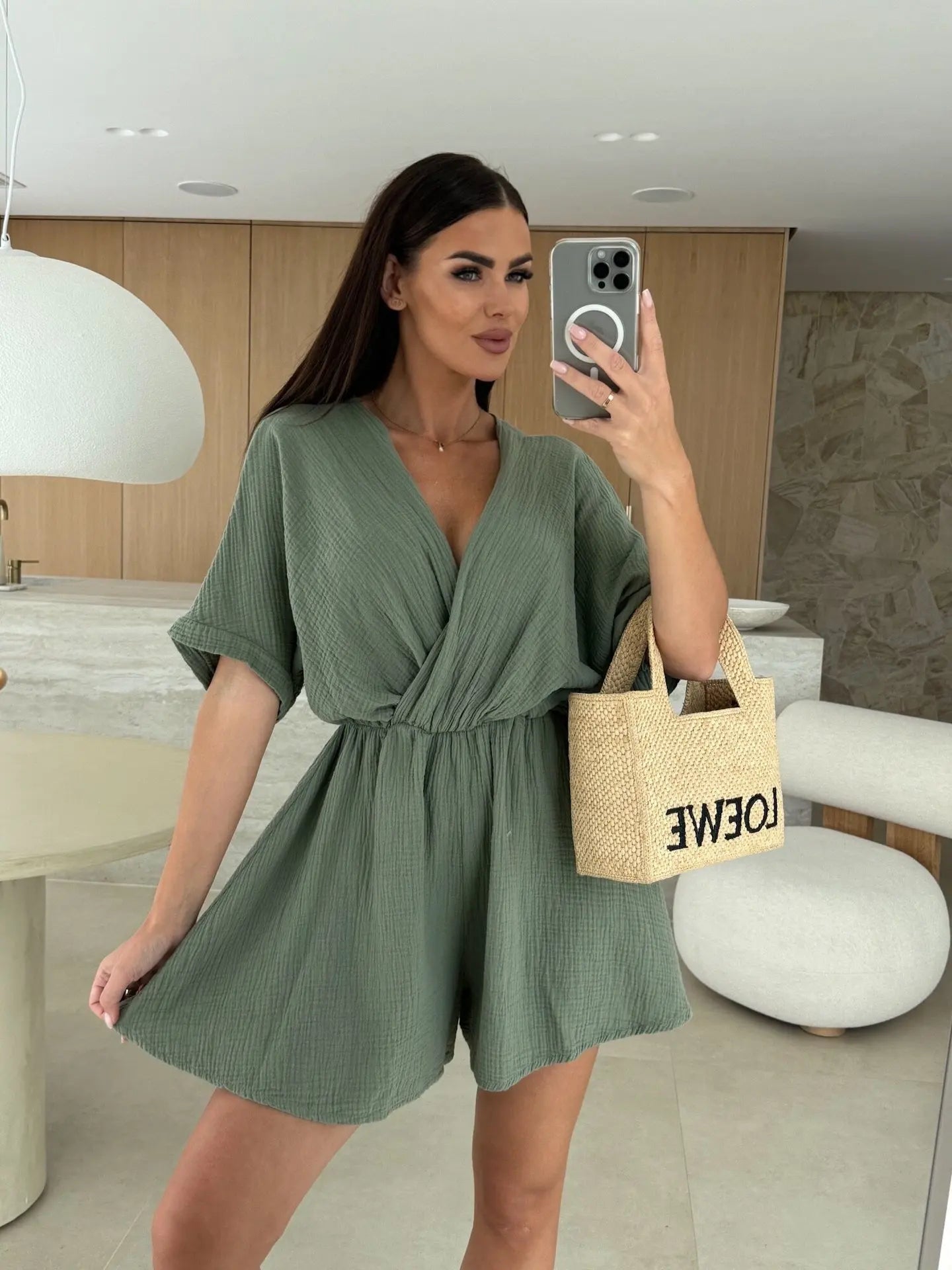 Elegant white romper with a deep V-neck and short sleeves — light, effortless, and perfect for summer days.