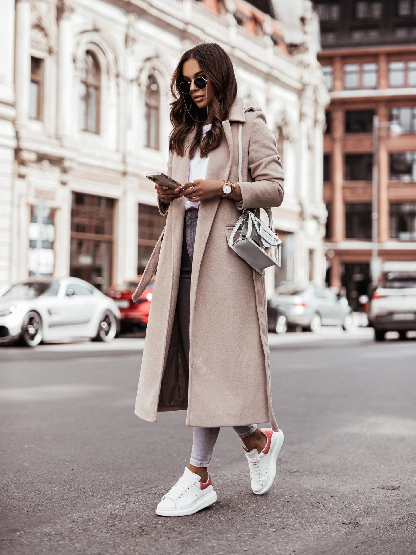 Fashionable women’s wool coat with long sleeves and a belted wrap design. Elegant and versatile — perfect for spring and autumn.