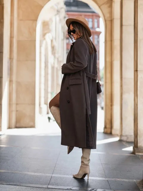 Timeless elegance for cold days. A sleek long-sleeve coat with a belted silhouette—where comfort meets modern sophistication.